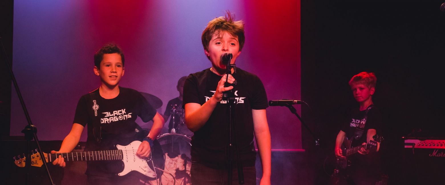 child singing on stage