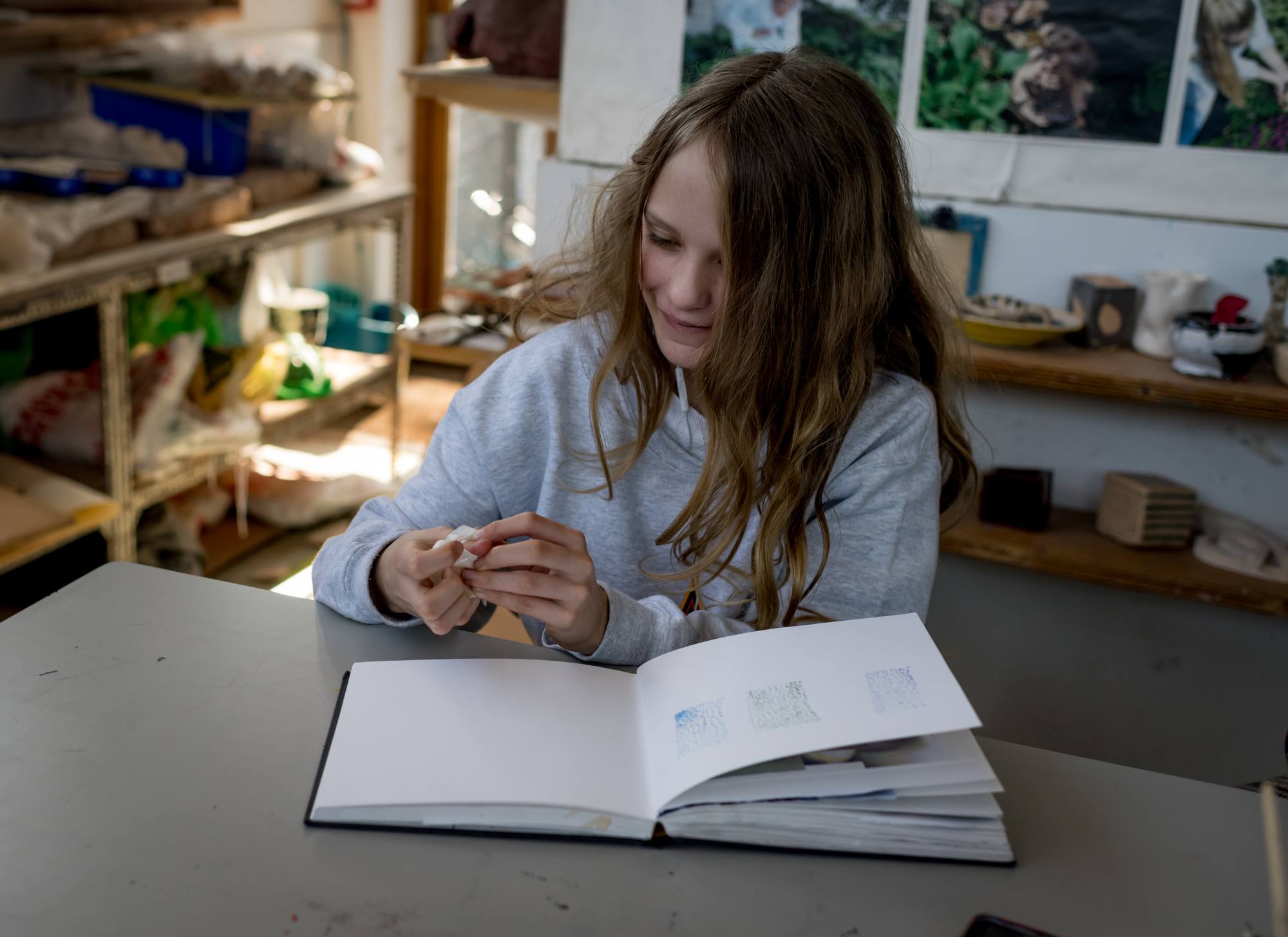 young girl with a sketch book