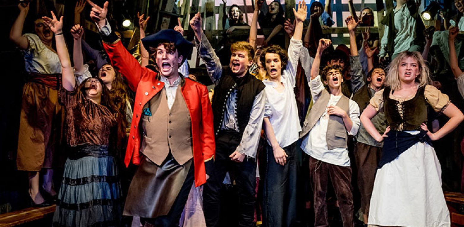 Upper School students performing in Les Mis