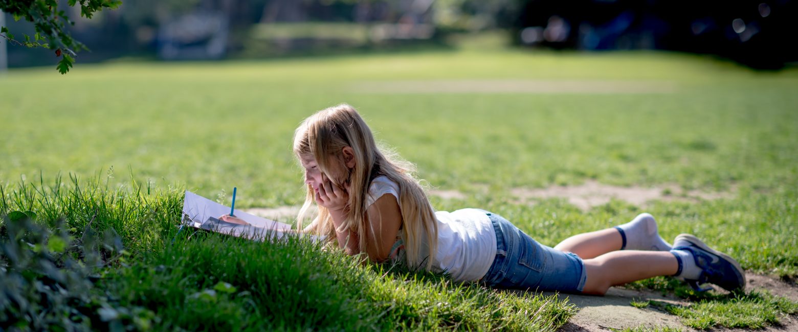 Child working on the grass