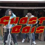 Students riding bikes with red text 'GHOST BOIS'
