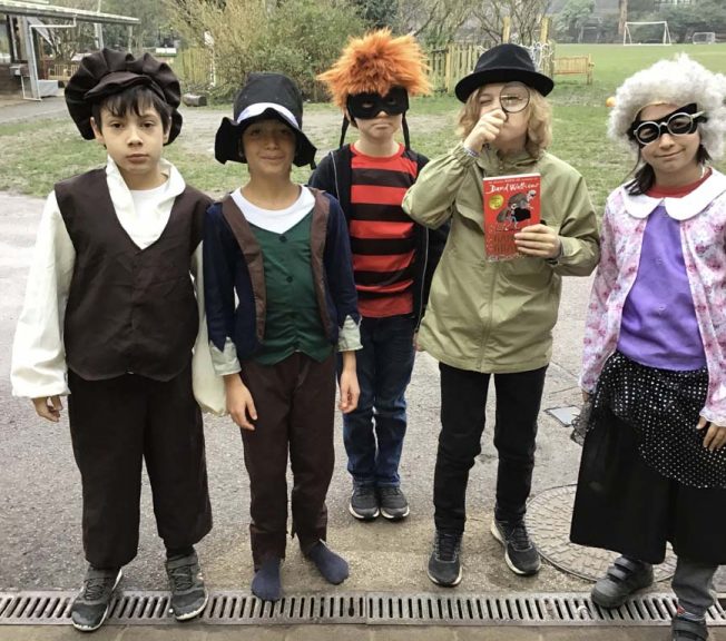 Lower school student wearing costumes