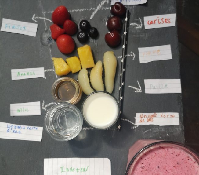 Birds eye view of a picture of cup holding the ingredients for a smoothie