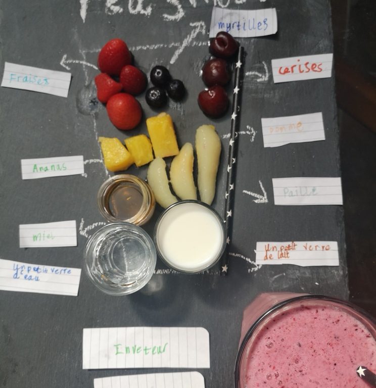 Birds eye view of a picture of cup holding the ingredients for a smoothie