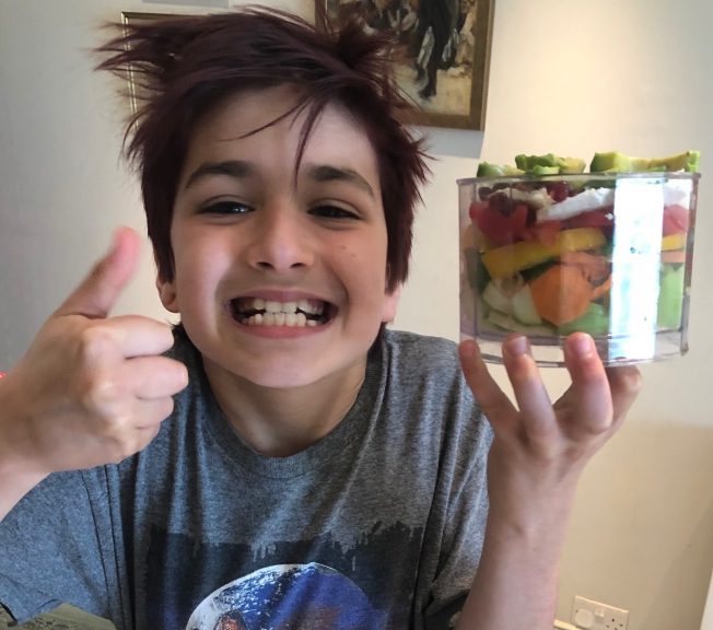 Student holding a salad