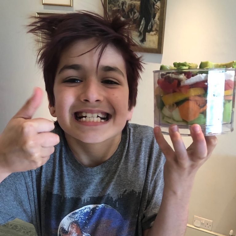 Student holding a salad