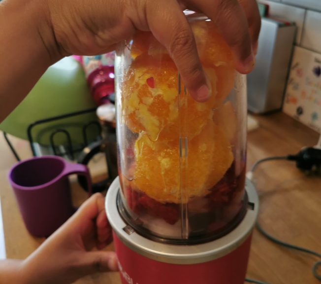 Student making a smoothie
