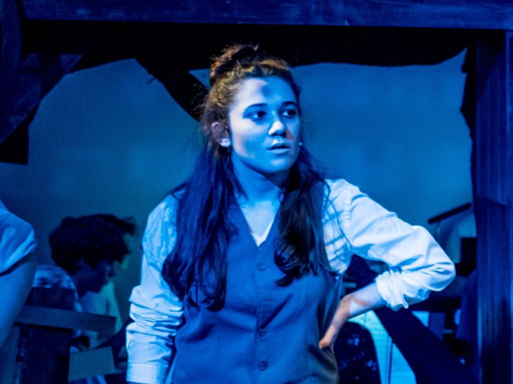 Student performing in Les Mis