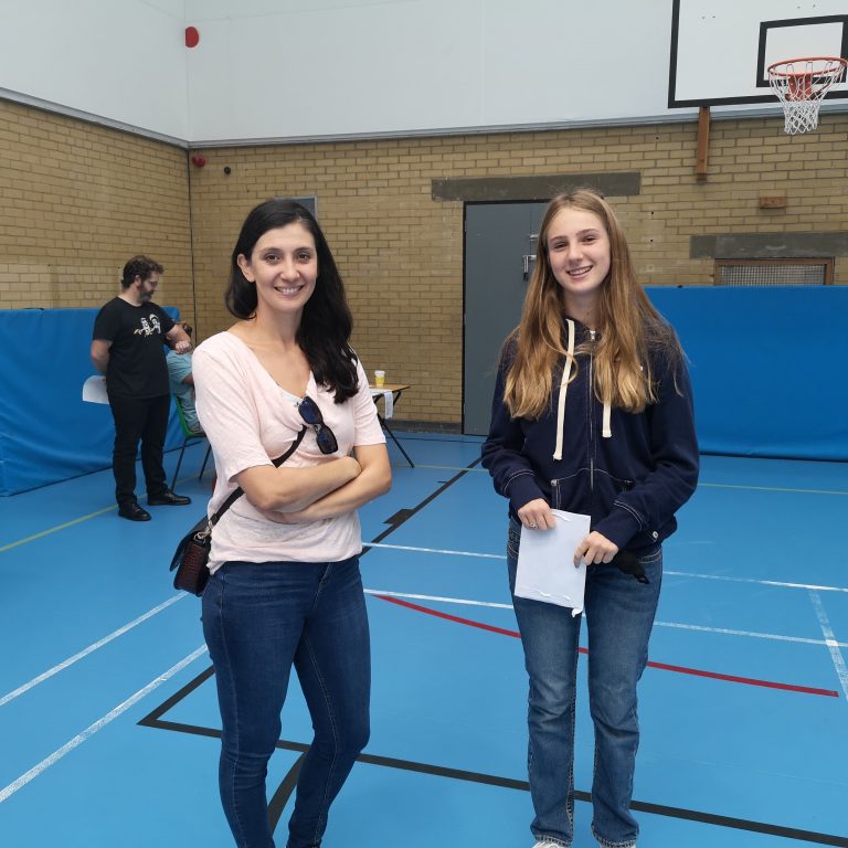 student holding exam results