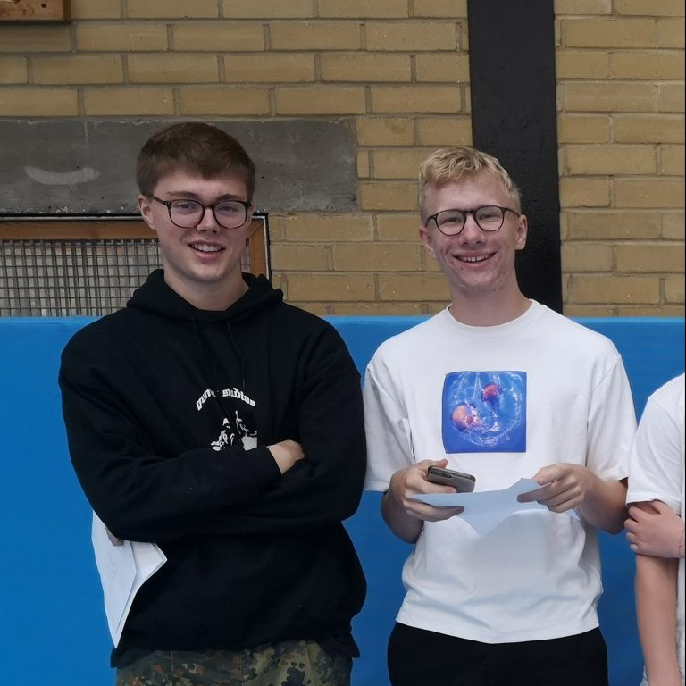 Students holding exam results