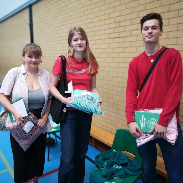 Sixth form students holding hoodies