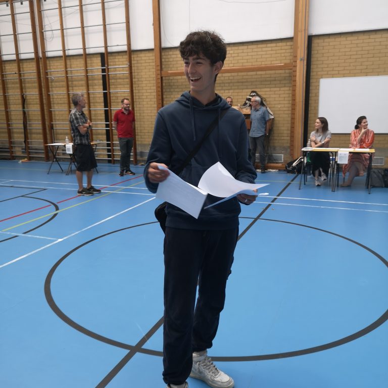 Student holding exam results