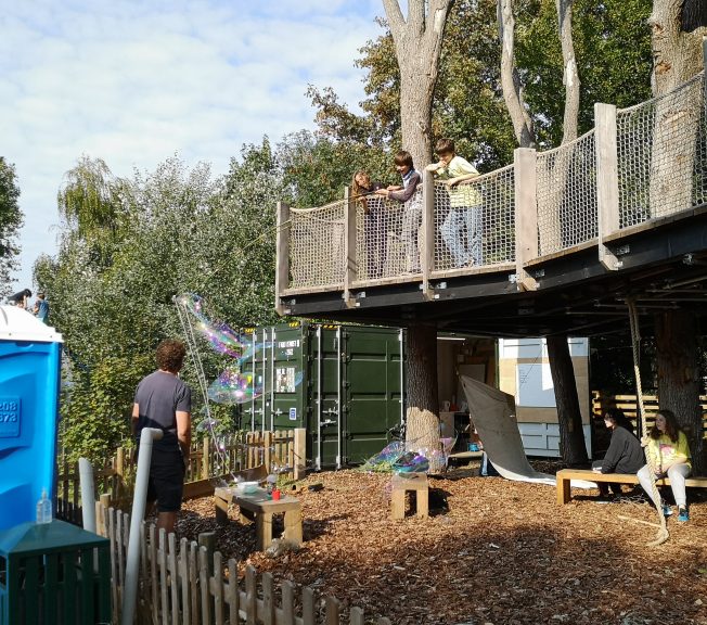 Students in the tree house blowing bubbles