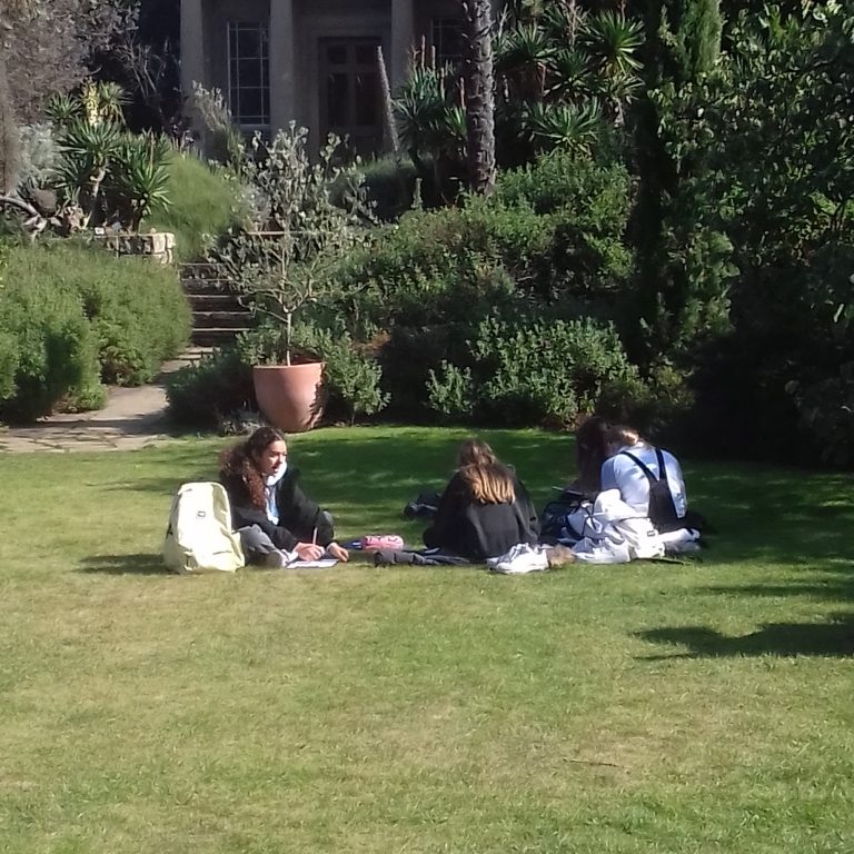 Students sitting on the ground
