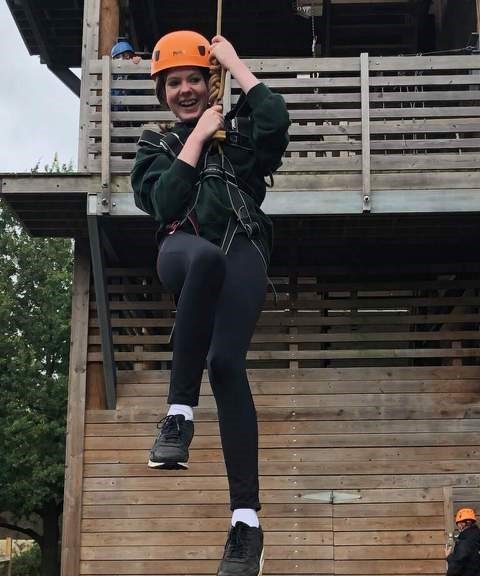 Student holding onto rope