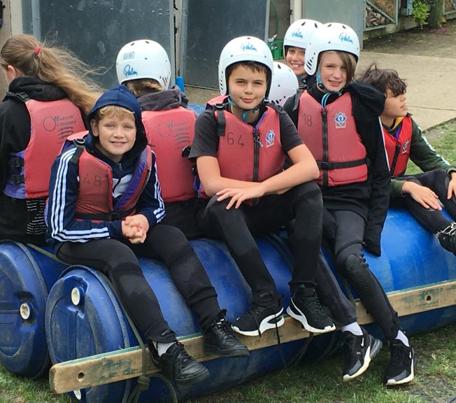 Students wearing life jackets