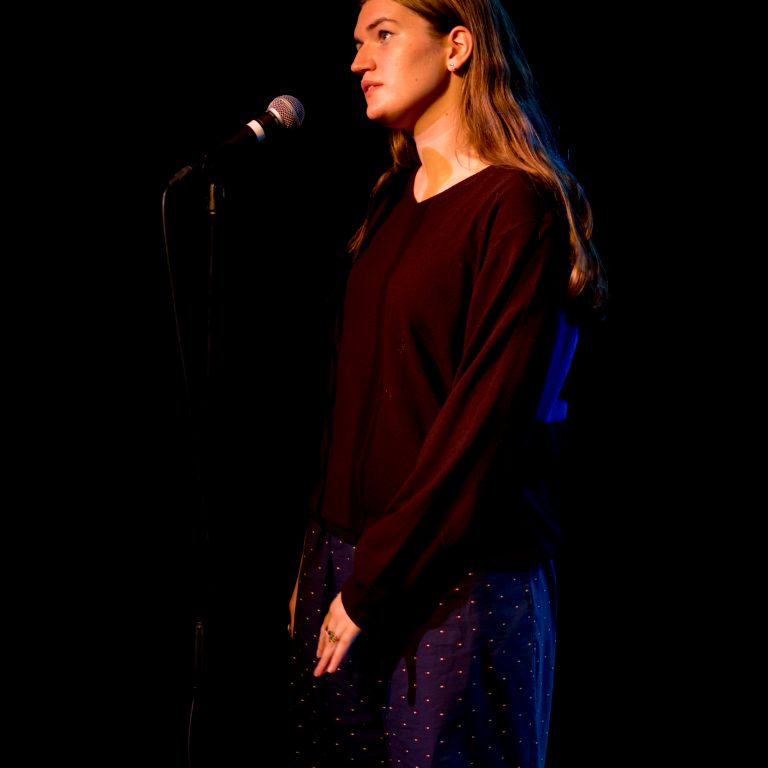 Student singing for school concert