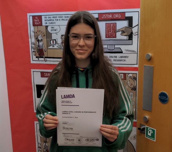 Student holding LAMDA results