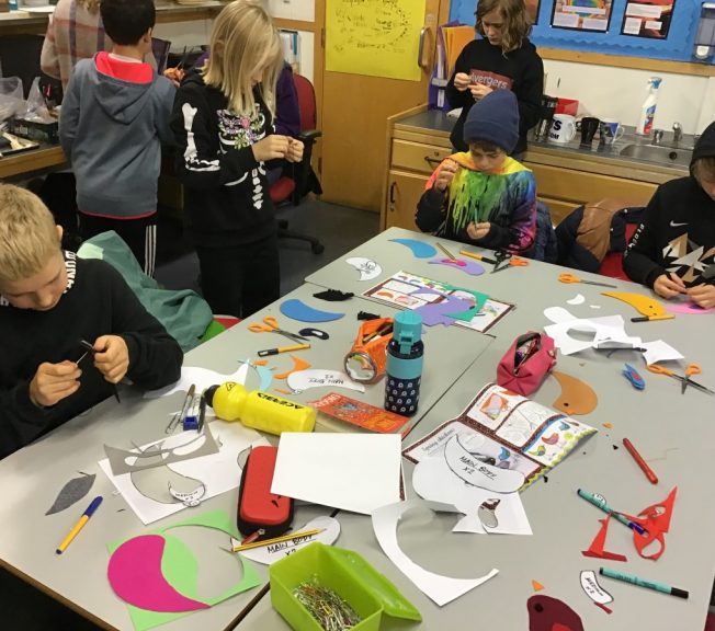 Students making paper birds