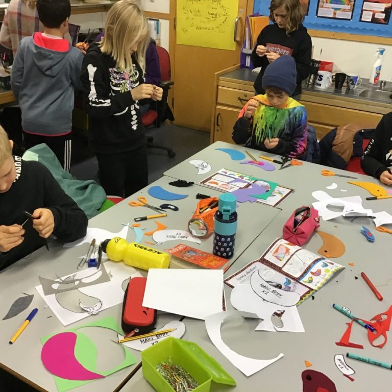 Students making paper birds