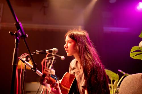 student playing guitar