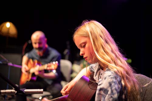student playing guitar