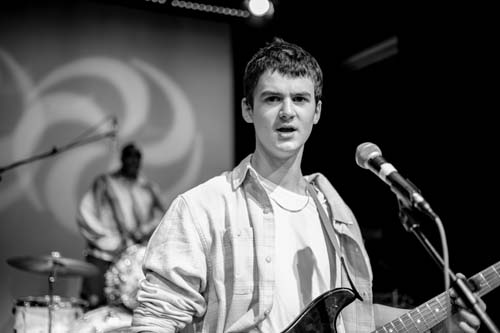 Student playing guitar