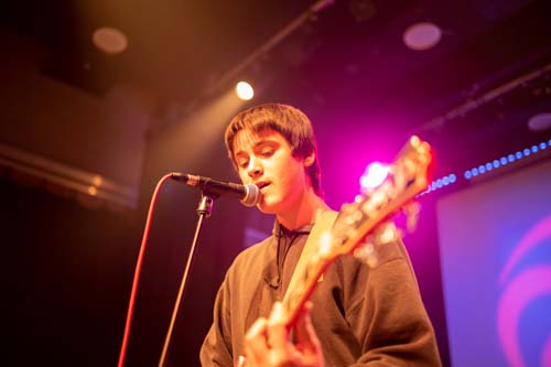 Student playing guitar