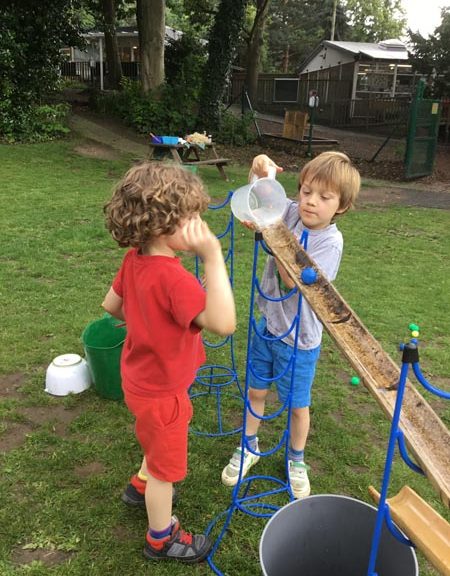 Students pouring water