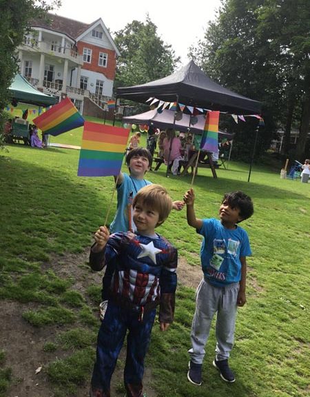 Students holding rainbow flags