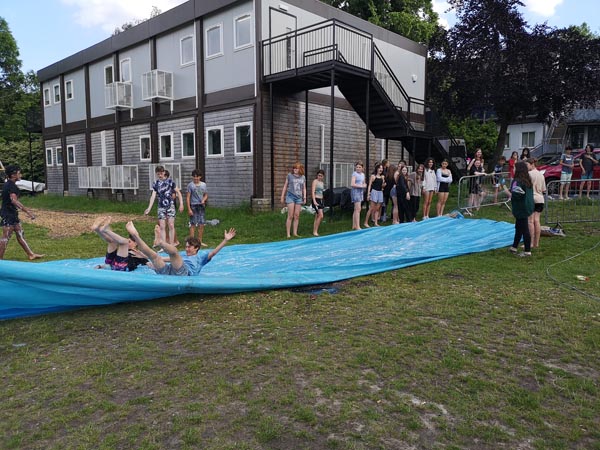 students on a water slide