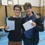 Students holding exam results
