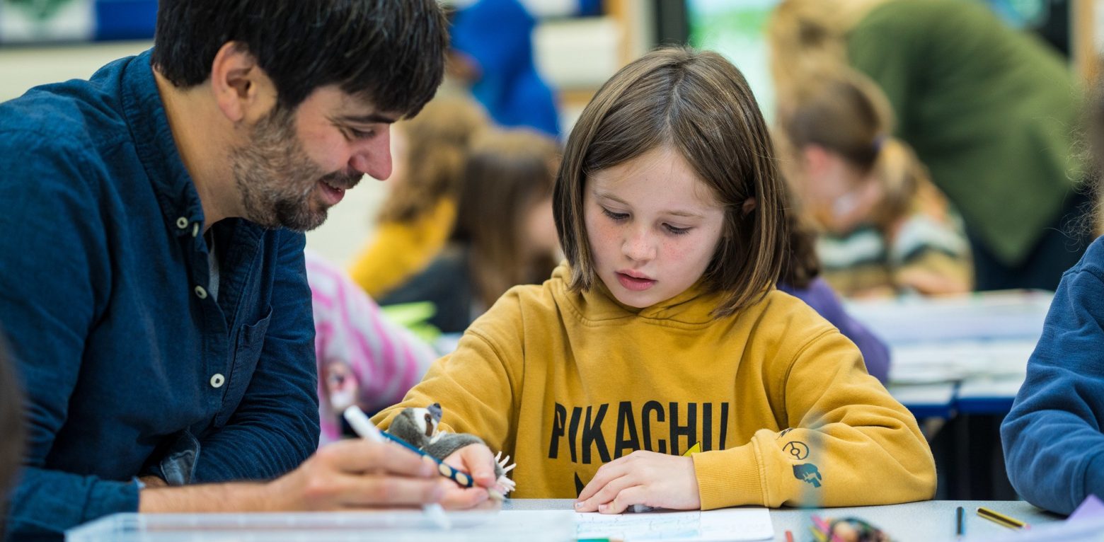 Year 3 student working with teacher