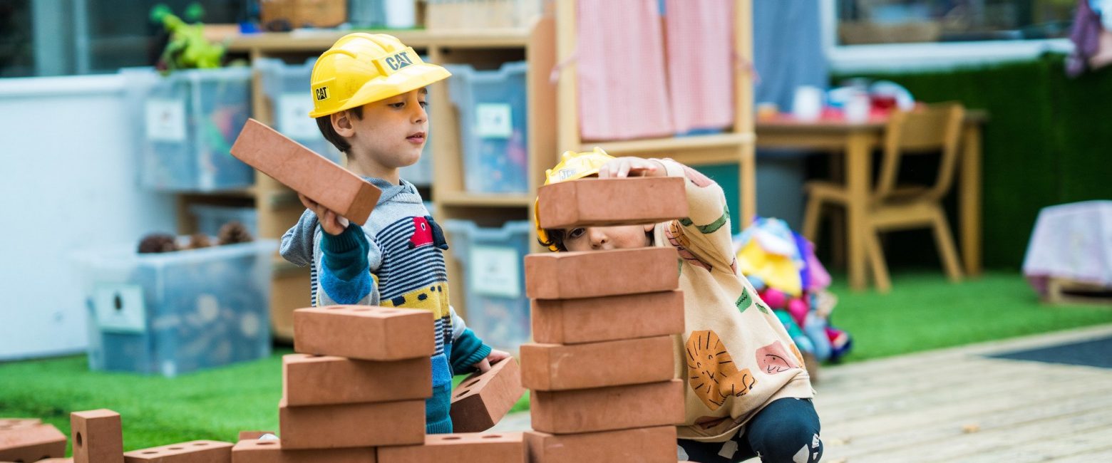 Reception students building with blocks