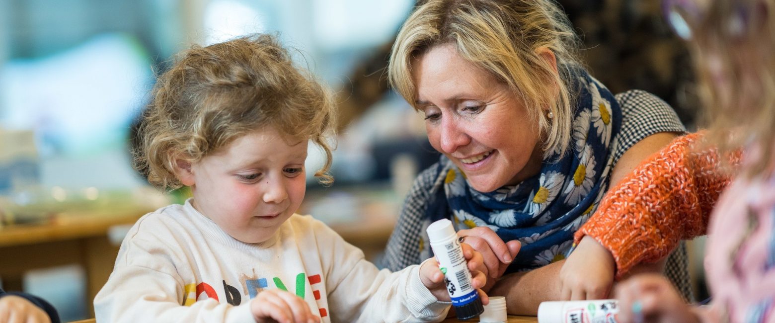 Reception teacher with pupil