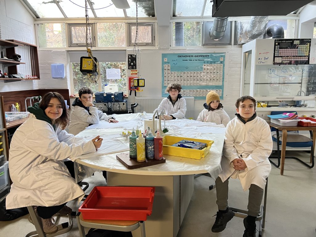 students in science coats