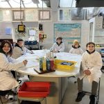 students in science coats