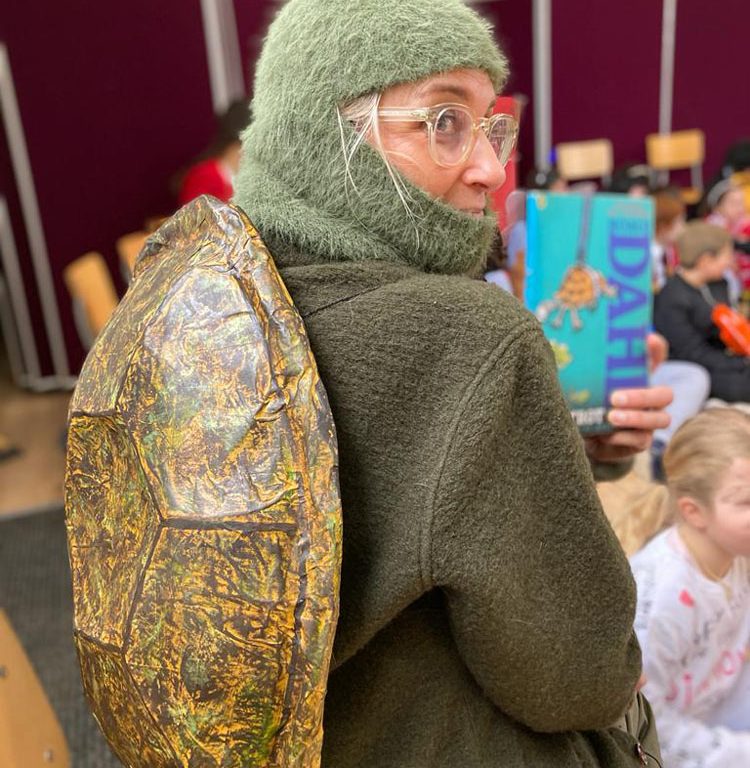 staff wearing world book day costume