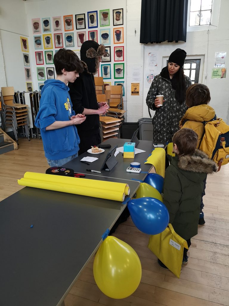 students selling food for Ukrainian Fundraiser