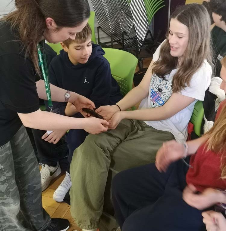 students reacting to holding an animal