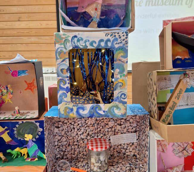 Close-up of a selection of decorated shoeboxes.
