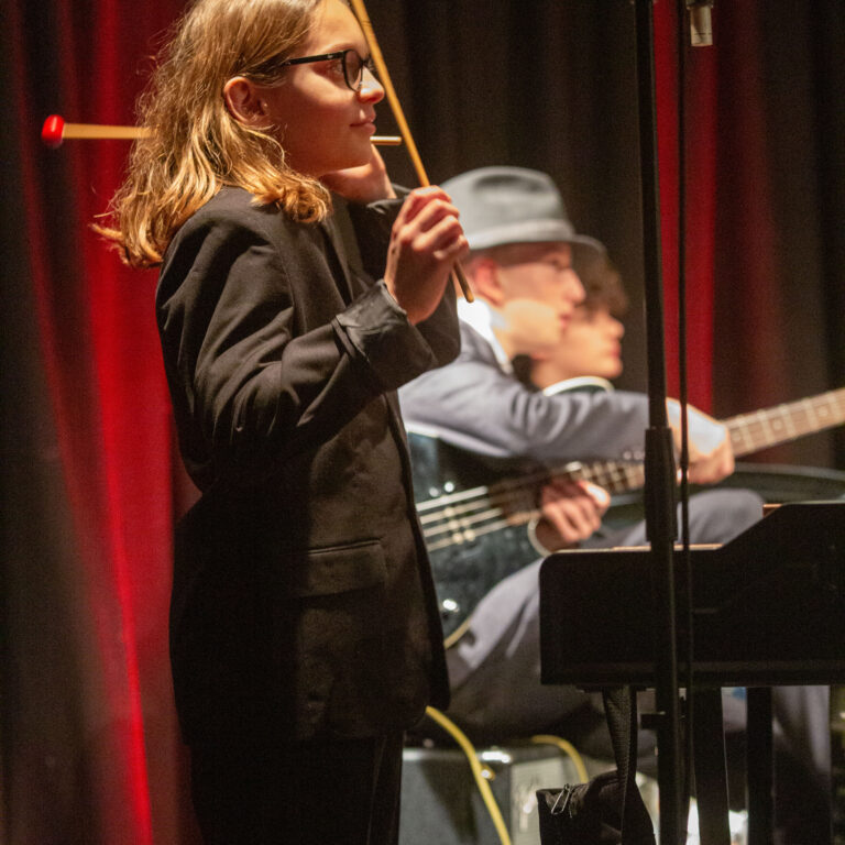 A student performing on stage