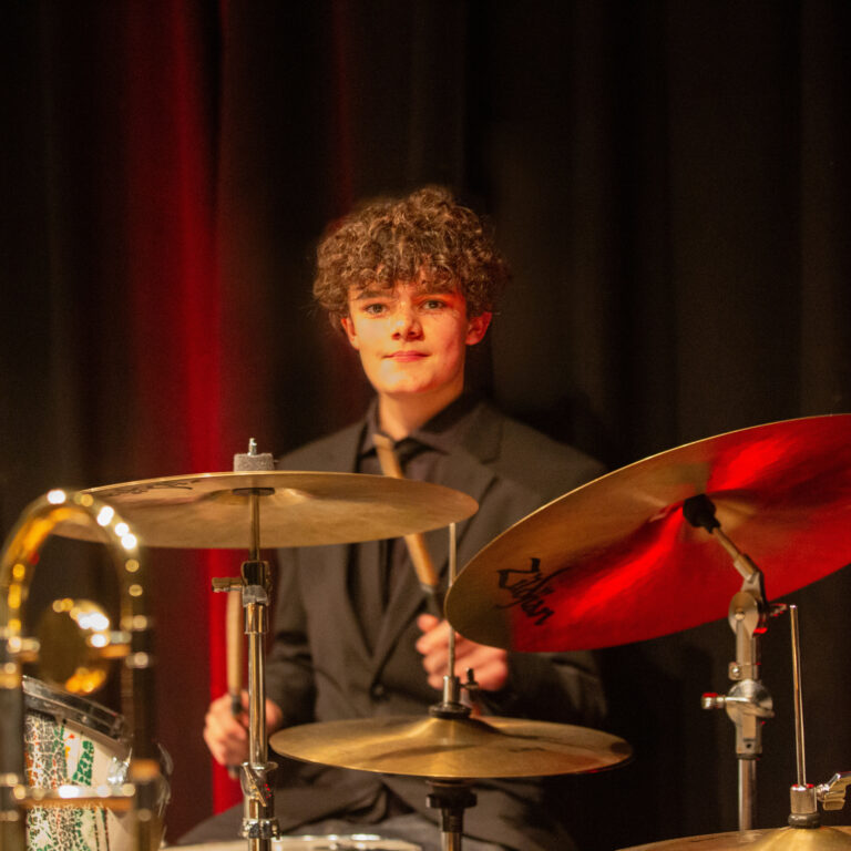 A student on the drums at the King Alfred School jazz evening