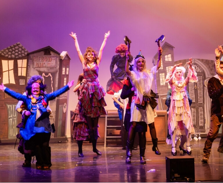 The cast of The Ballad of Raggedy Alice dance on stage