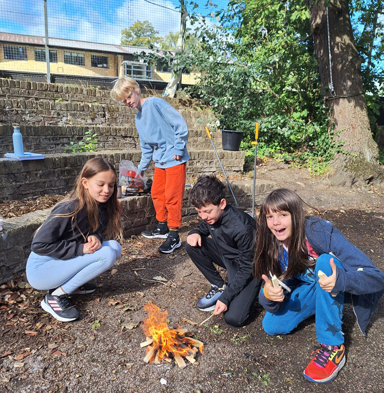 Students at The King Alfred School learning to light a campfire