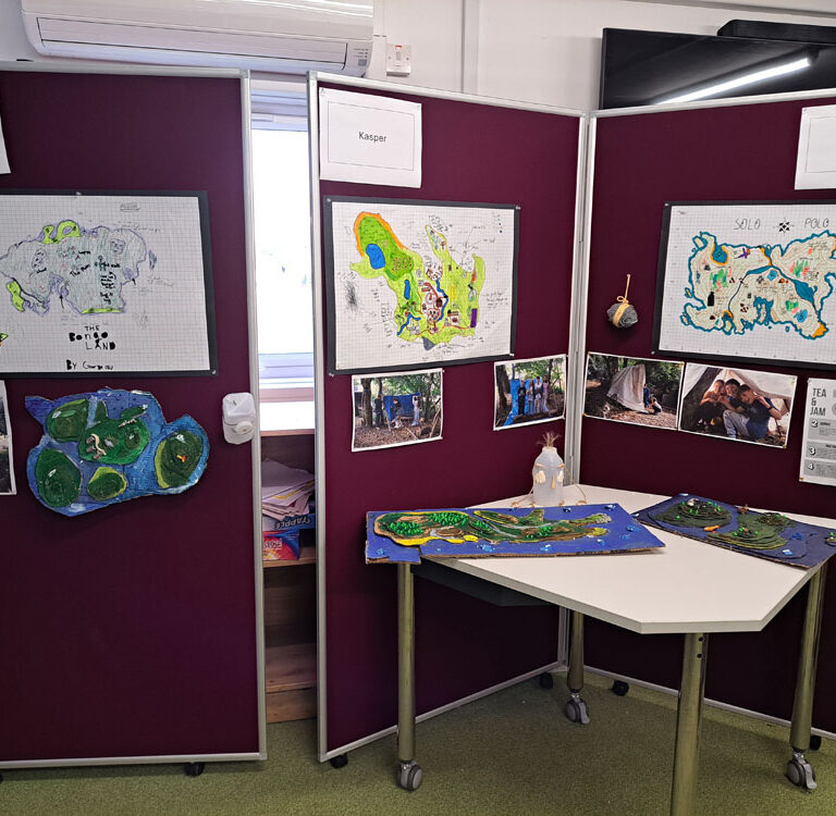 Display boards showing maps and other elements of a survival project by Year 7 at The King Alfred School