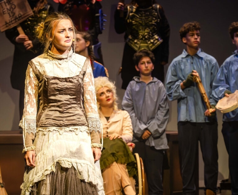 Ensemble of The Ballard of Raggedy Alice perform on stage