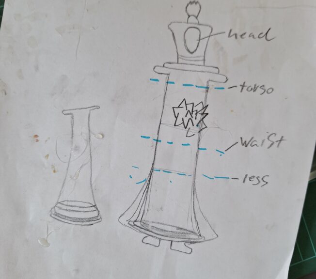 A pencil sketch showing the design for a wearable chess piece