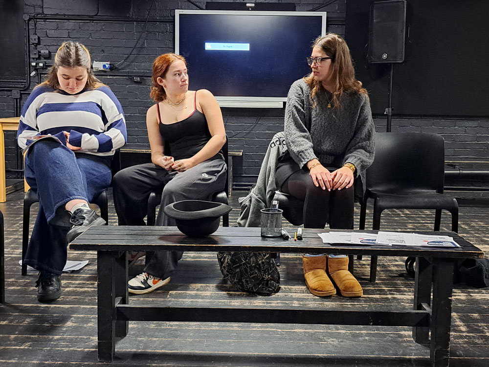 Three girls from The King Alfred School North London perform a play in a rehearsal space