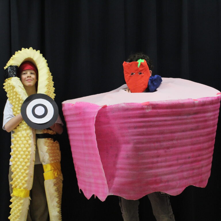 Two students wear abstract art designs.